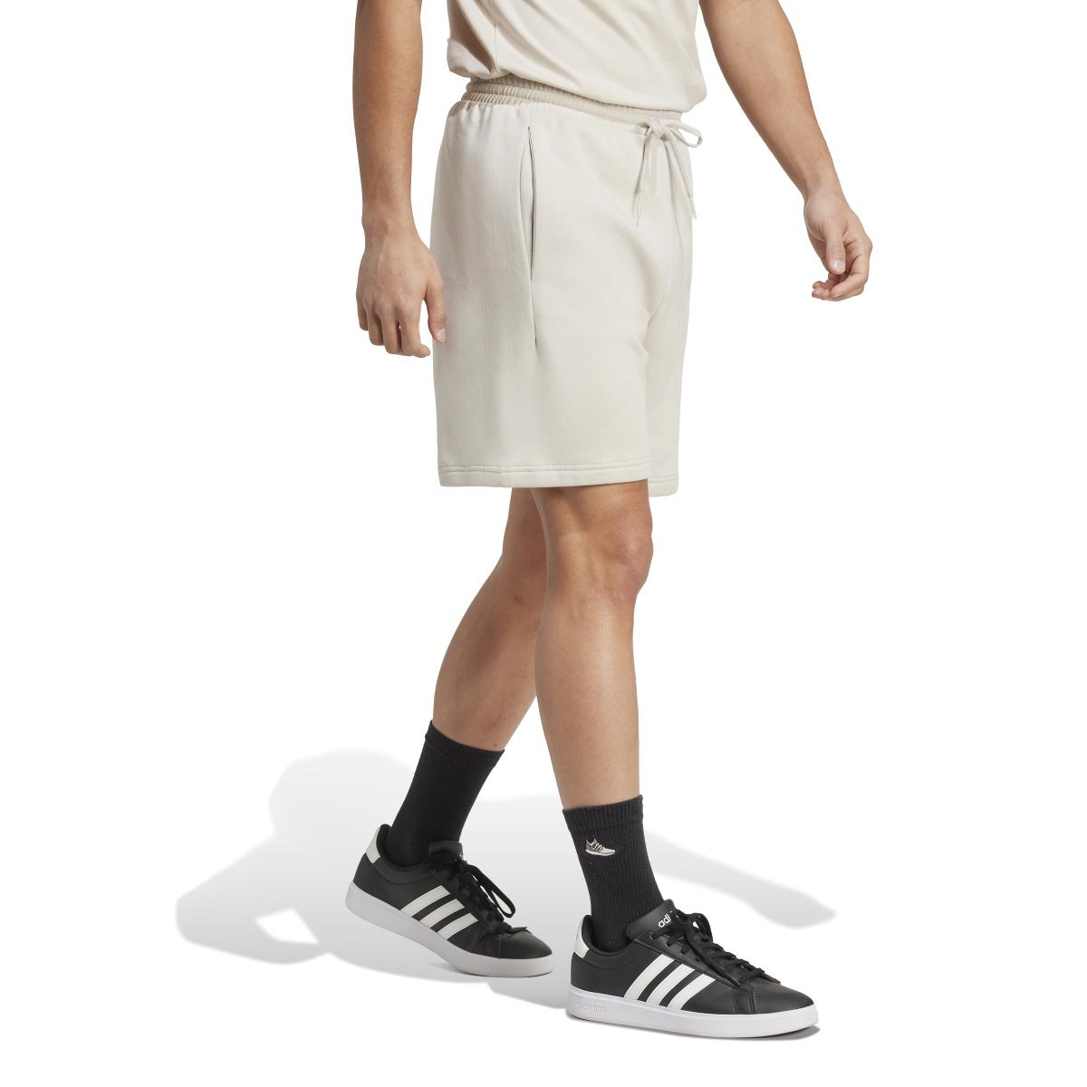 product/2/0/2025_adidas_jm1726_4_apparel_on_model_walking_view_white.jpg