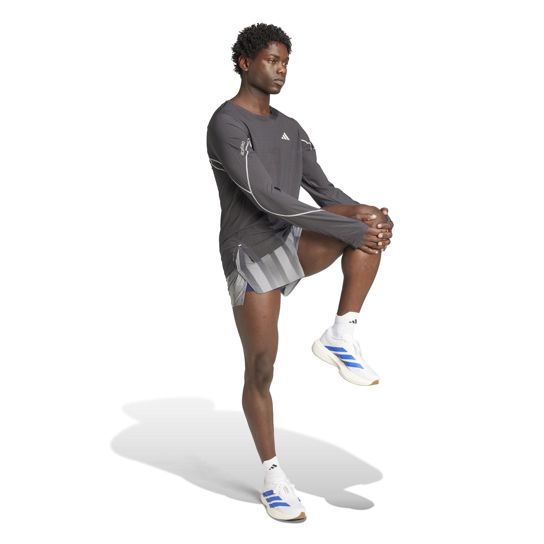 product/2/0/2025_09_adidas_jp1565_4_apparel_on_model_walking_view_white.jpg