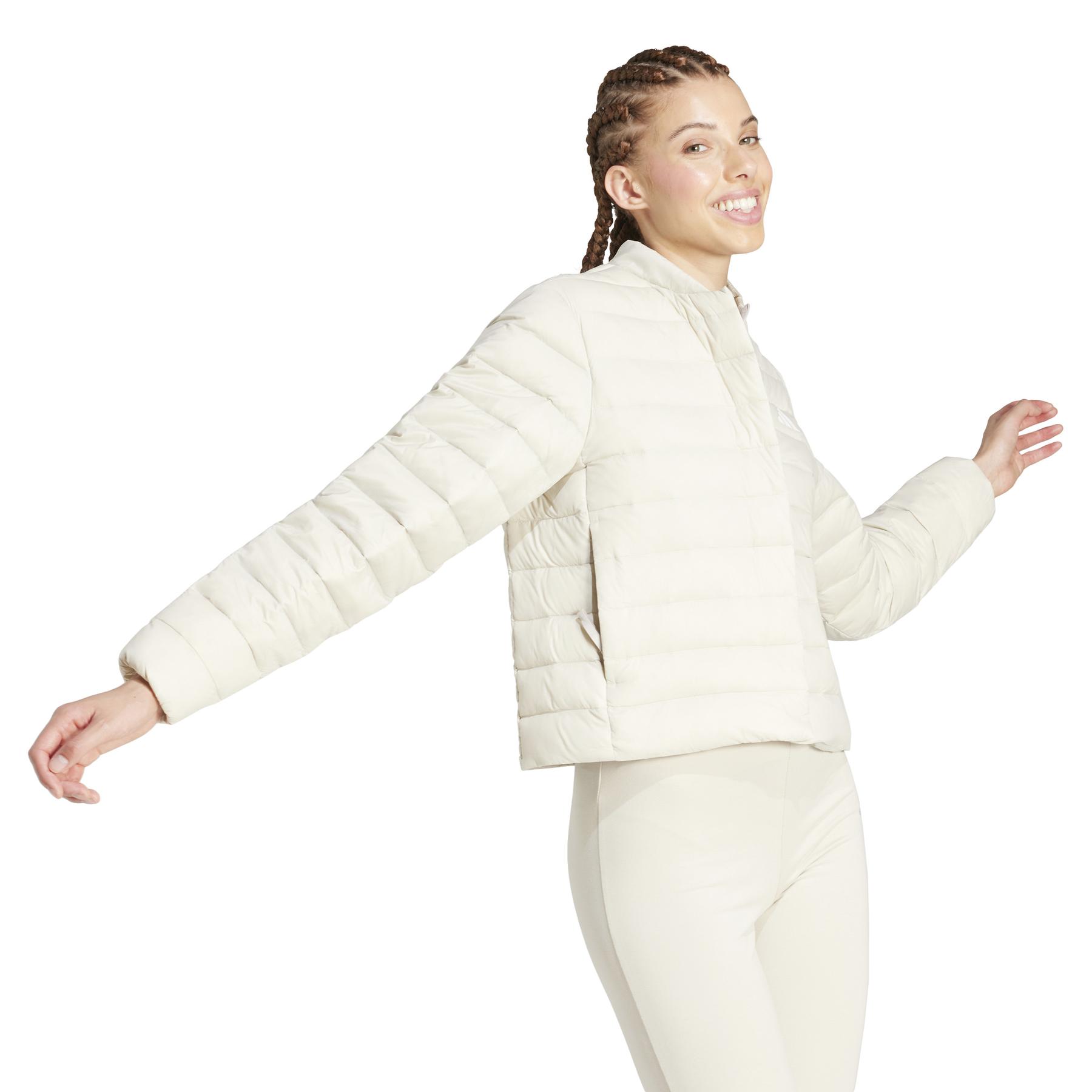 2/0/2025_adidas_jj1196_4_apparel_on_model_walking_view_white.jpg