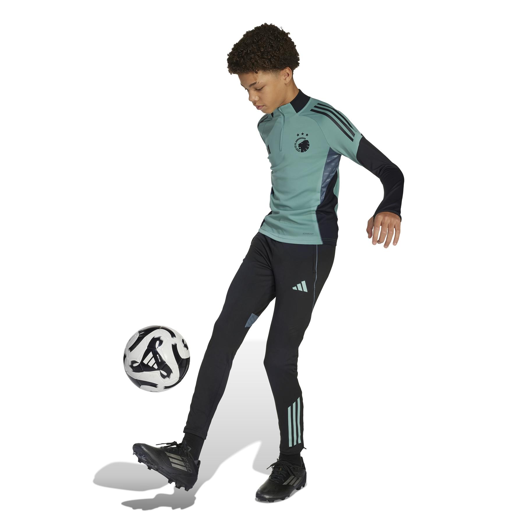 product/2/0/2025_adidas_jl6321_4_apparel_on_model_walking_view_white.jpg