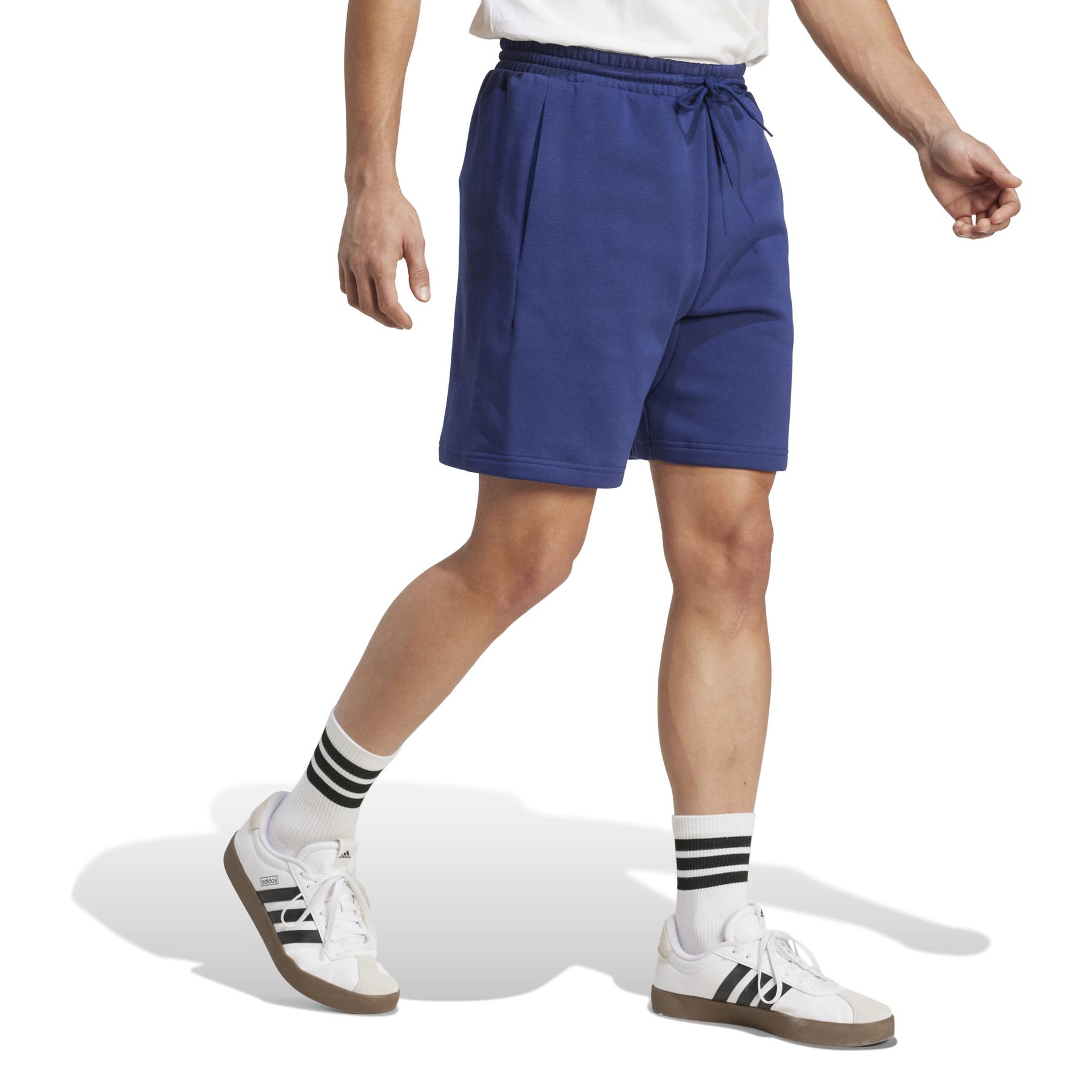product/2/0/2025_adidas_jm1728_4_apparel_on_model_walking_view_white.jpg
