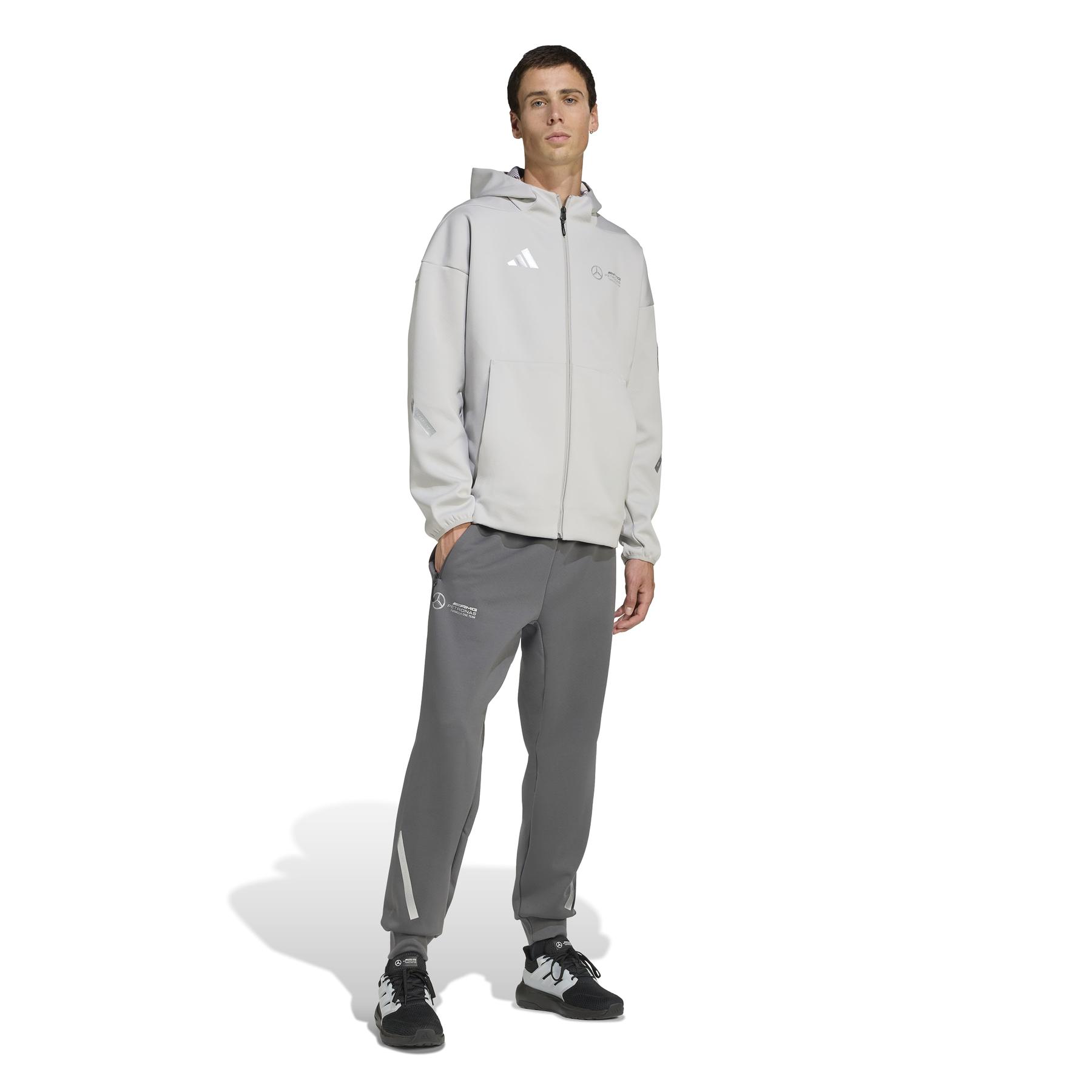 2/0/2025_adidas_jw3478_4_apparel_on_model_walking_view_white.jpg