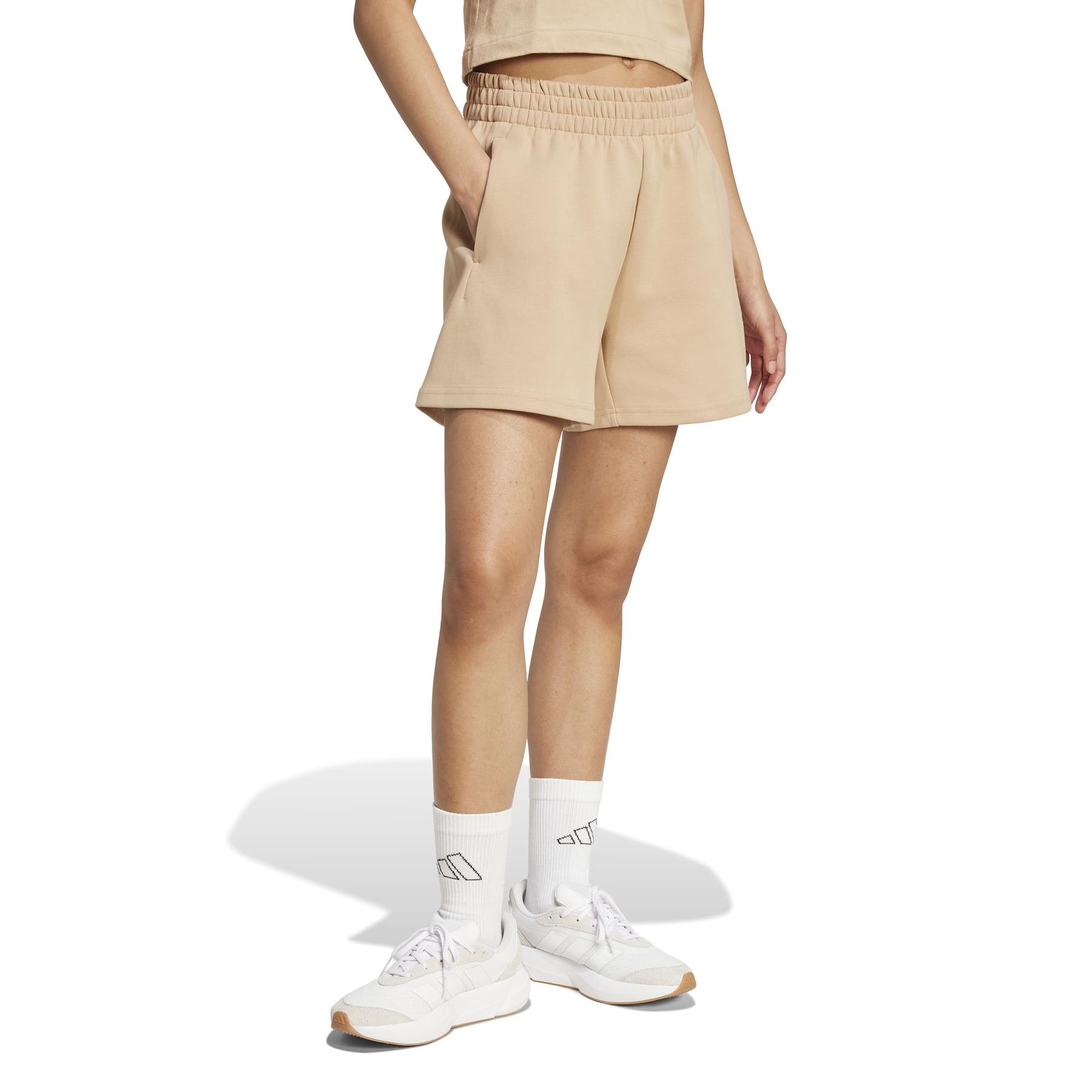 2/0/2025_adidas_jx0448_4_apparel_on_model_walking_view_white.jpg