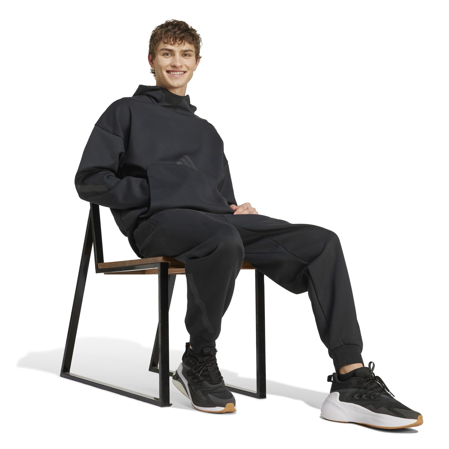 product/a/d/adidas_jd9599_5_apparel_on_model_walking_view_white.jpg
