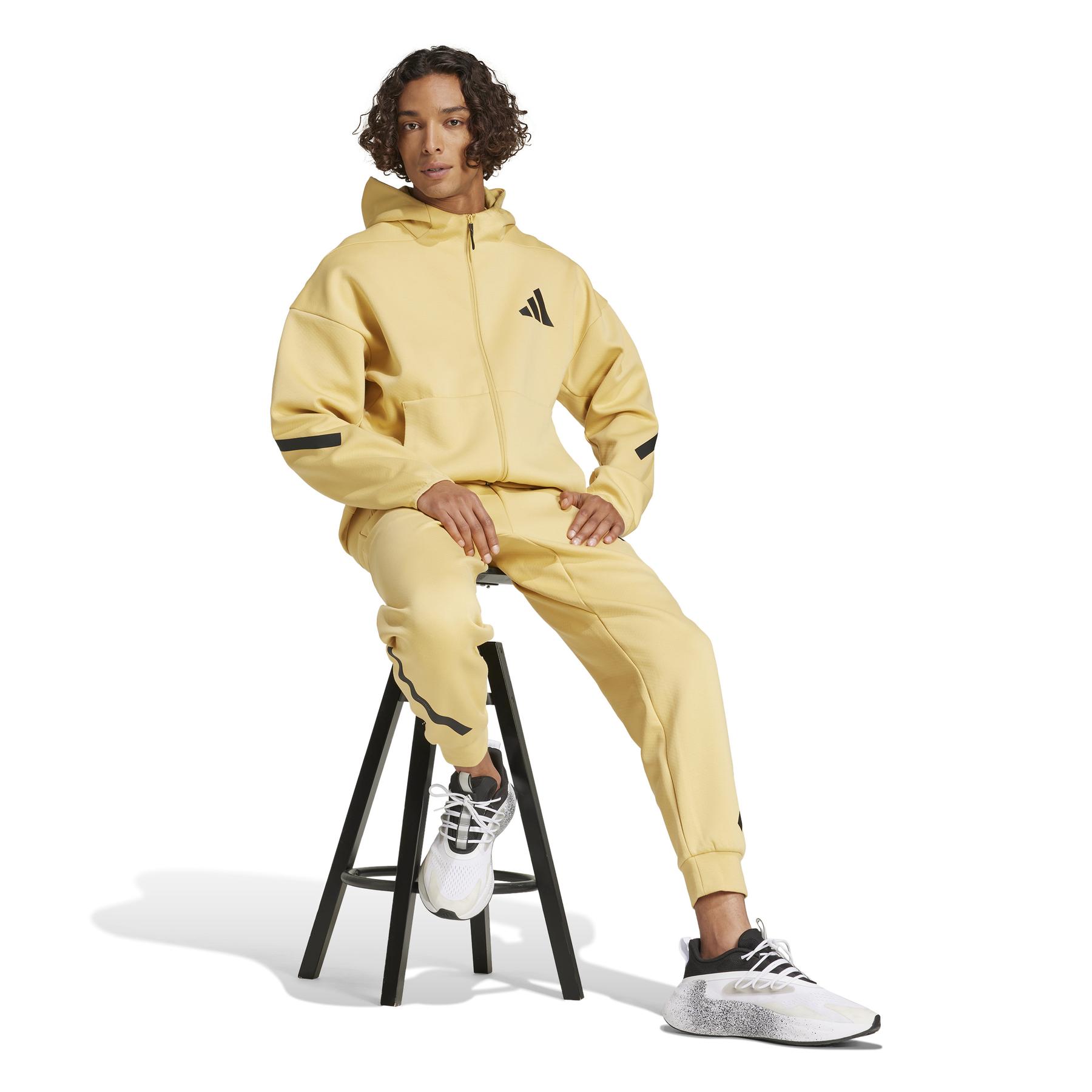 a/d/adidas_je3068_6_apparel_on_model_walking_view_white.jpg